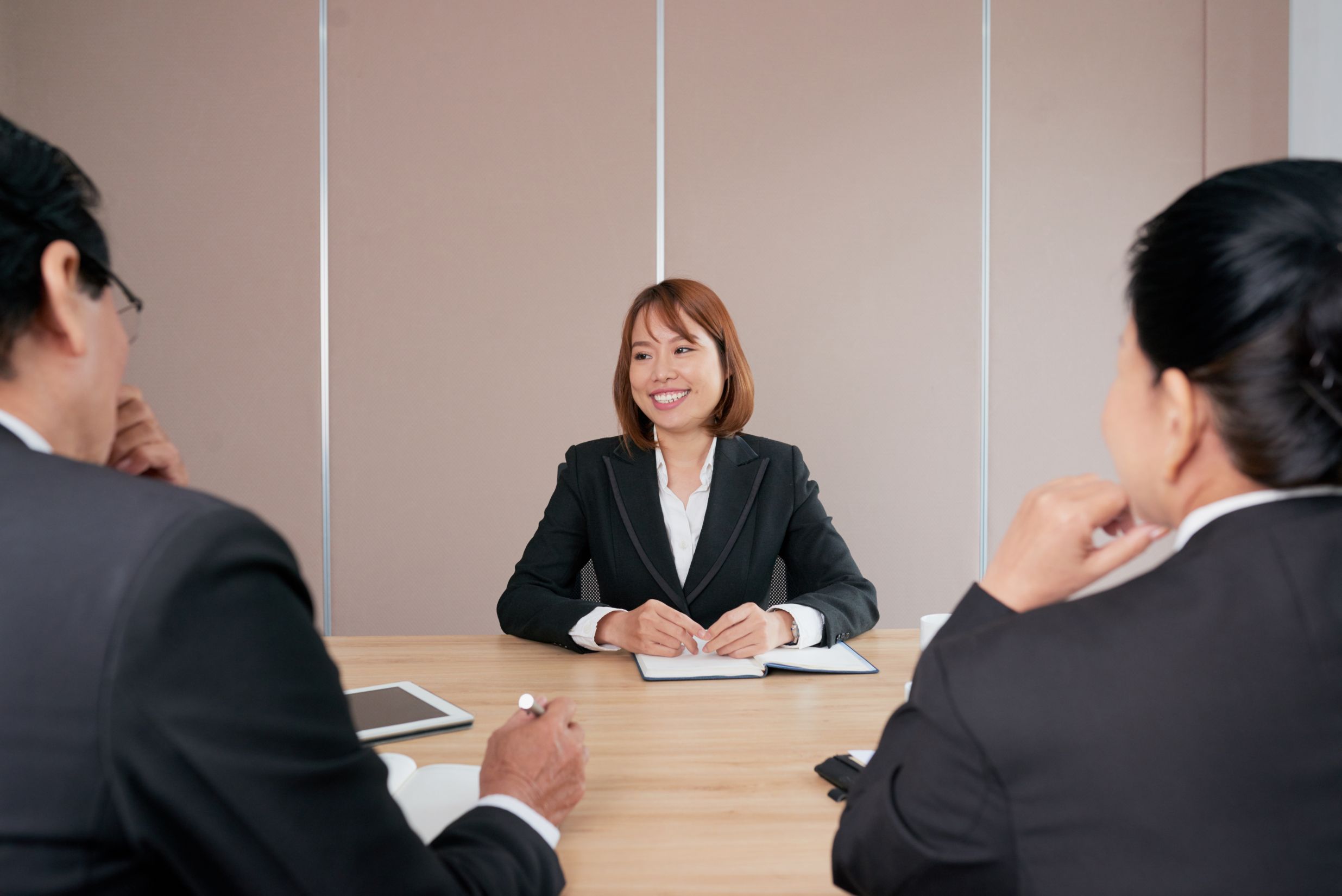 Women in an interview giving satisfactory answers